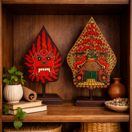 Close-up of natural wood grain and carved motif on Gunungan wall art