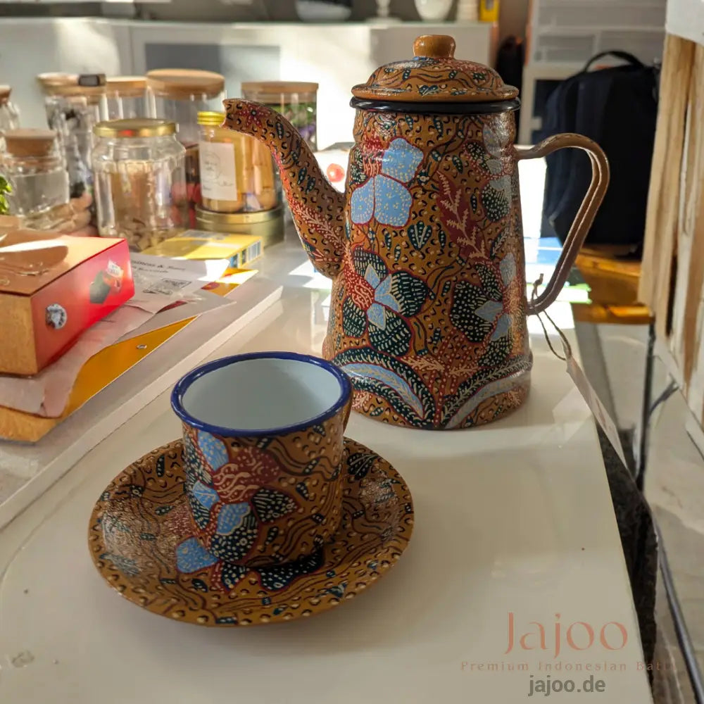 Batik enamel tea set styled in a modern living room