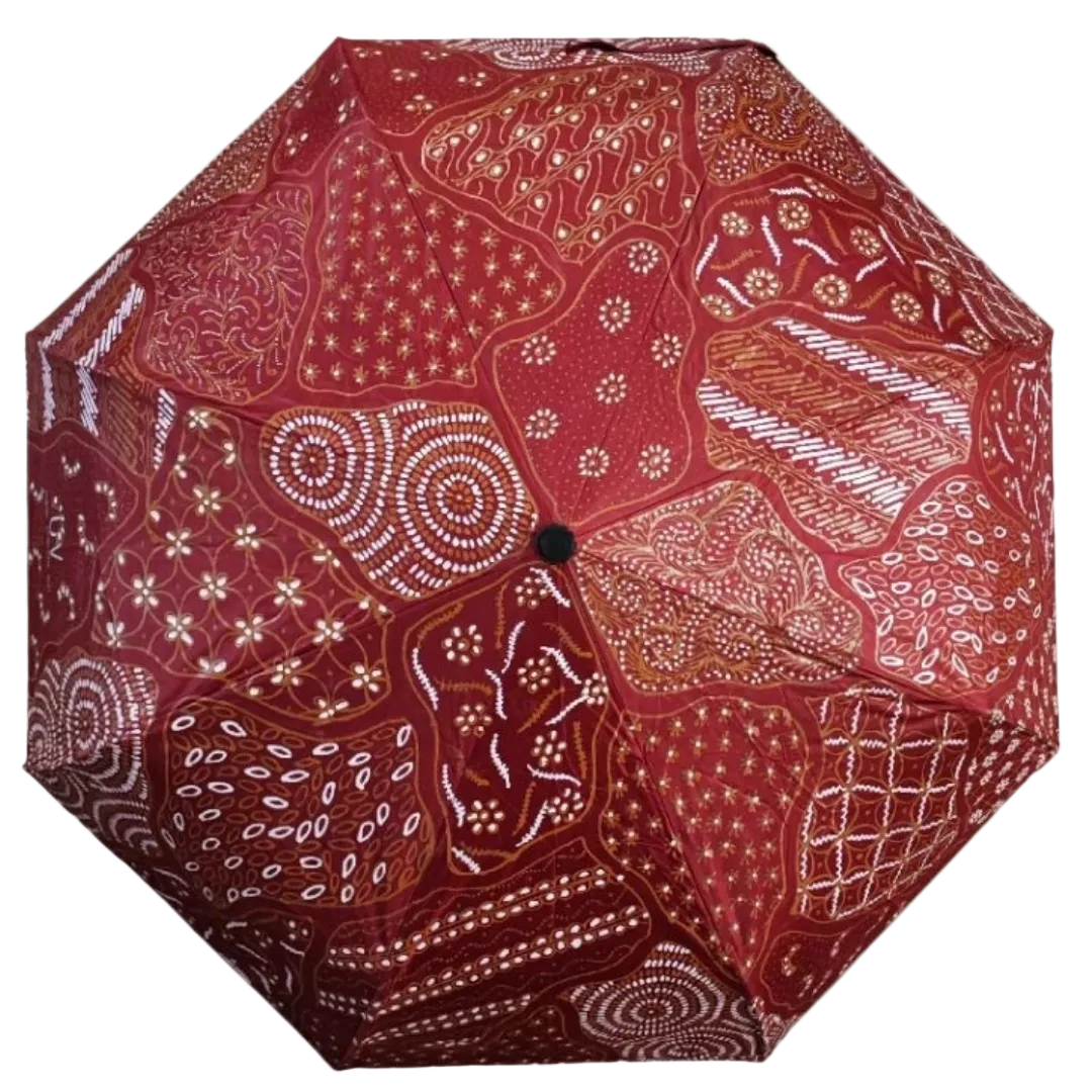 Handmade batik umbrella — Crimson red patchwork canopy, Yogyakarta, Indonesia