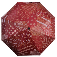 Handmade batik umbrella — Crimson red patchwork canopy, Yogyakarta, Indonesia