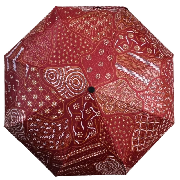 Handmade batik umbrella — Crimson red patchwork canopy, Yogyakarta, Indonesia