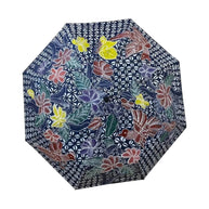 Payung Lukis hand-painted batik umbrella – hand-painted flowers in mauve, red and yellow on indigo geometric ground