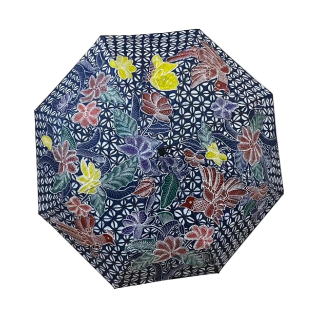 Payung Lukis hand-painted batik umbrella – hand-painted flowers in mauve, red and yellow on indigo geometric ground