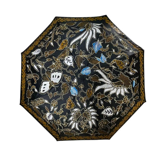 Payung Lukis hand-painted batik umbrella – Lung-Lungan vine and blossom motif on midnight-black canopy with gold border