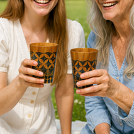 Hand-carved teak cup showing individual wood grain, handcrafted by Indonesian artisans