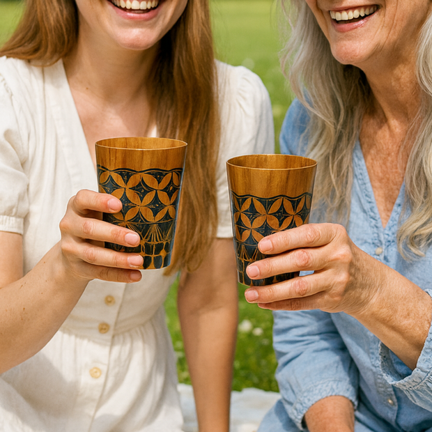 Hand-carved teak cup showing individual wood grain, handcrafted by Indonesian artisans