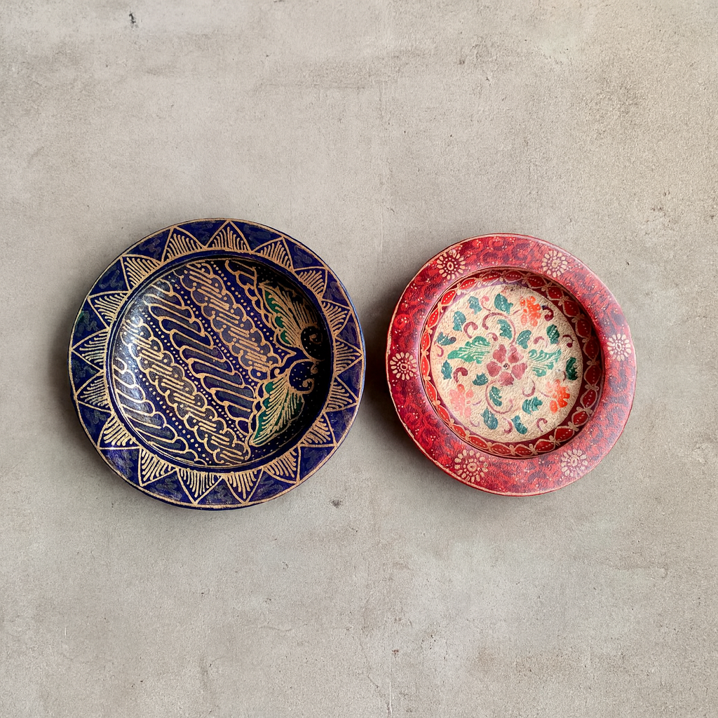 Hand-painted round plates styled on a dining table