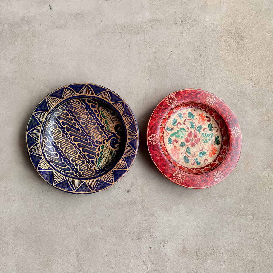 Hand-painted round plates styled on a dining table