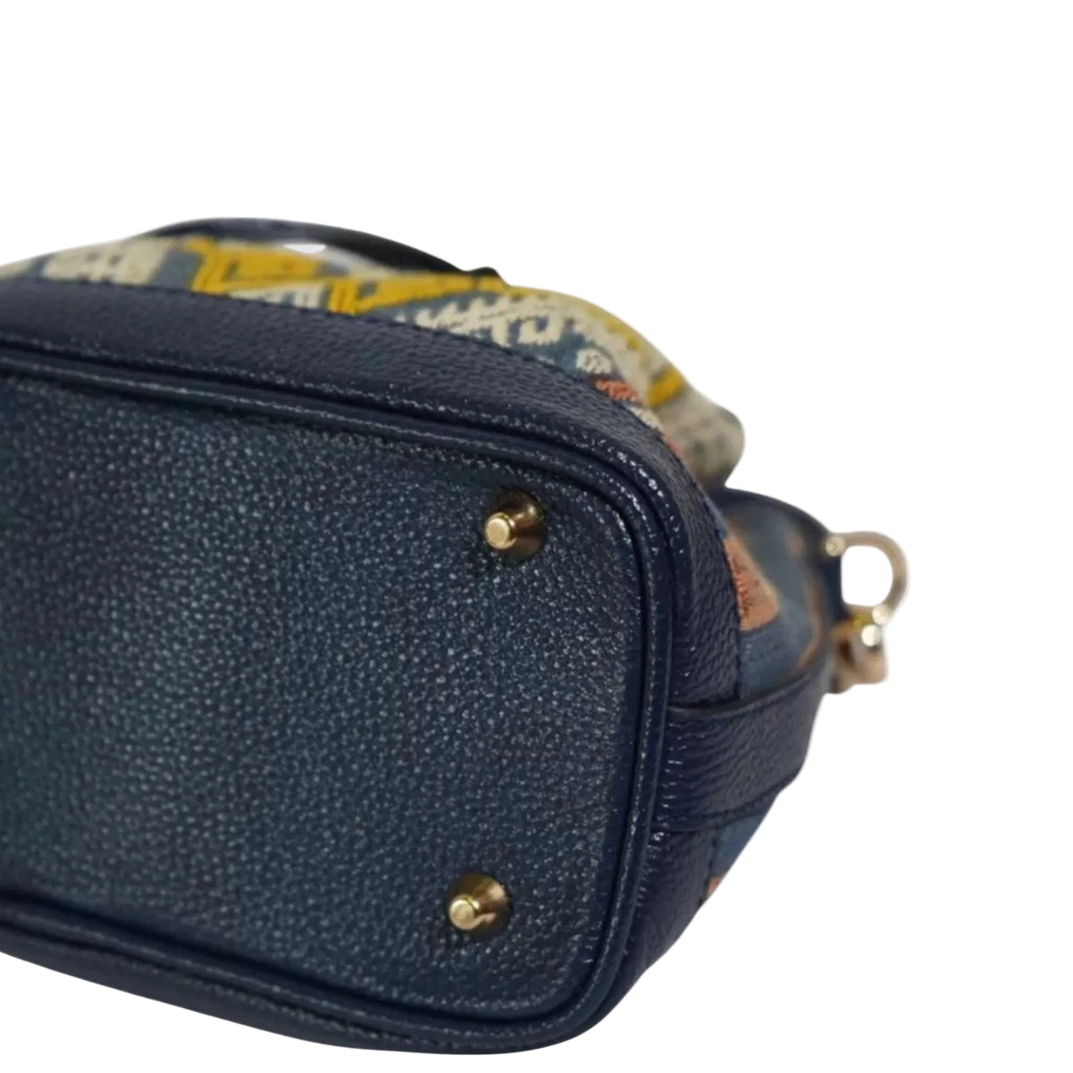 Back view of the navy and gold songket mini bucket bag with leather base