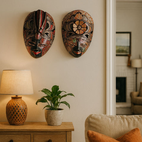 Close-up of hand-painted floral details on the carved wooden surface of the Merak – The Peacock's Bloom wall mask