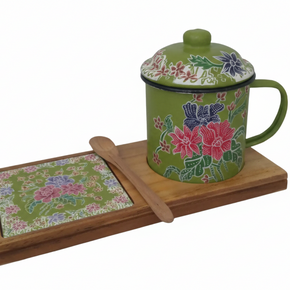 Senja Garden — hand-painted batik mug and coaster set with pink and violet florals on green enamel, on a wooden tray