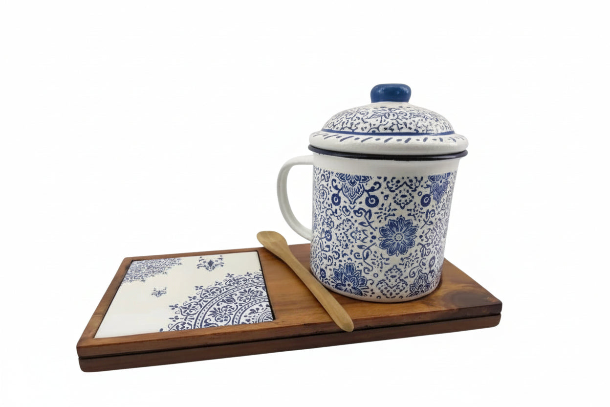 Senja Indigo — hand-painted batik mug and coaster set with blue floral motifs on white enamel, on a wooden tray