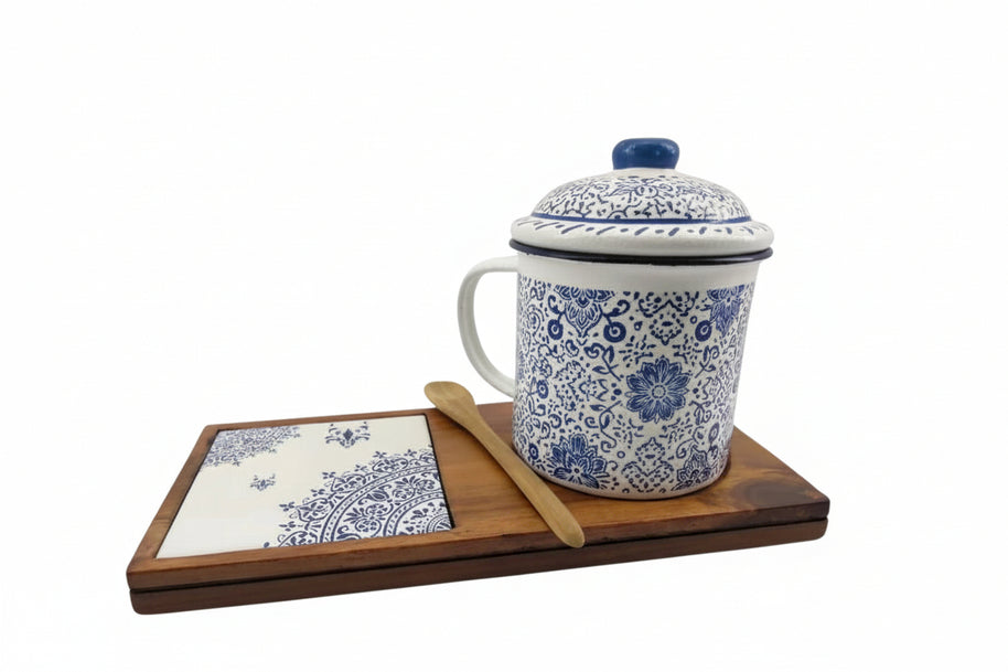 Senja Indigo — hand-painted batik mug and coaster set with blue floral motifs on white enamel, on a wooden tray