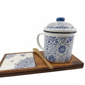 Senja Indigo — hand-painted batik mug and coaster set with blue floral motifs on white enamel, on a wooden tray
