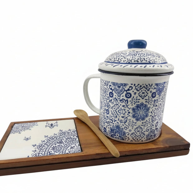 Senja Indigo — hand-painted batik mug and coaster set with blue floral motifs on white enamel, on a wooden tray