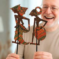 Hand-painted wayang figure showing carved detail and traditional motifs